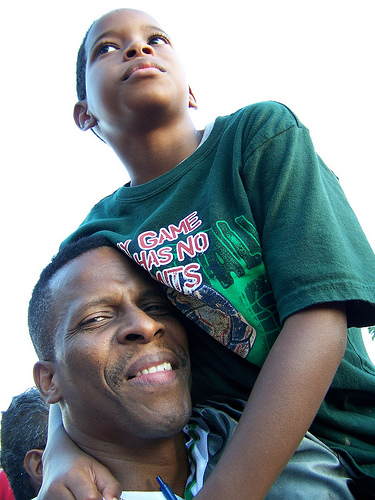 Father and son attending the Barack Obama campaign rally at Amway Arena in Orlando, Florida. Picture by Rob McCullough