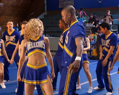 Screen capture from The CW series Hellcats showing male and female cheerleaders looking at each other during a routine