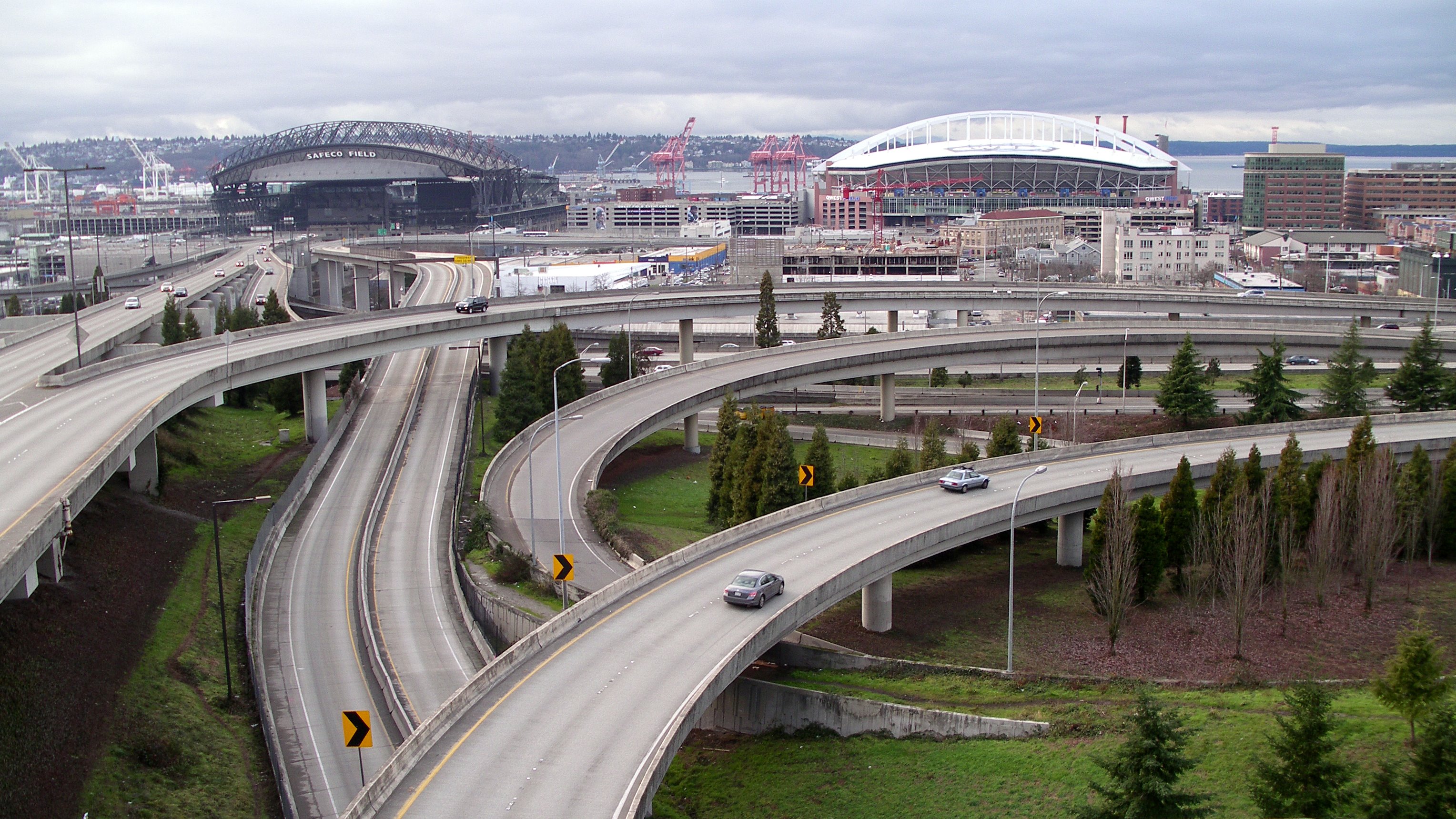 Photo of two interstate highways, Interstate 90 and Interstate 5, merging in a mixmaster. Taken by Matthew Rutledge and released under a Creative Commons Attribution 2.0 Generic license